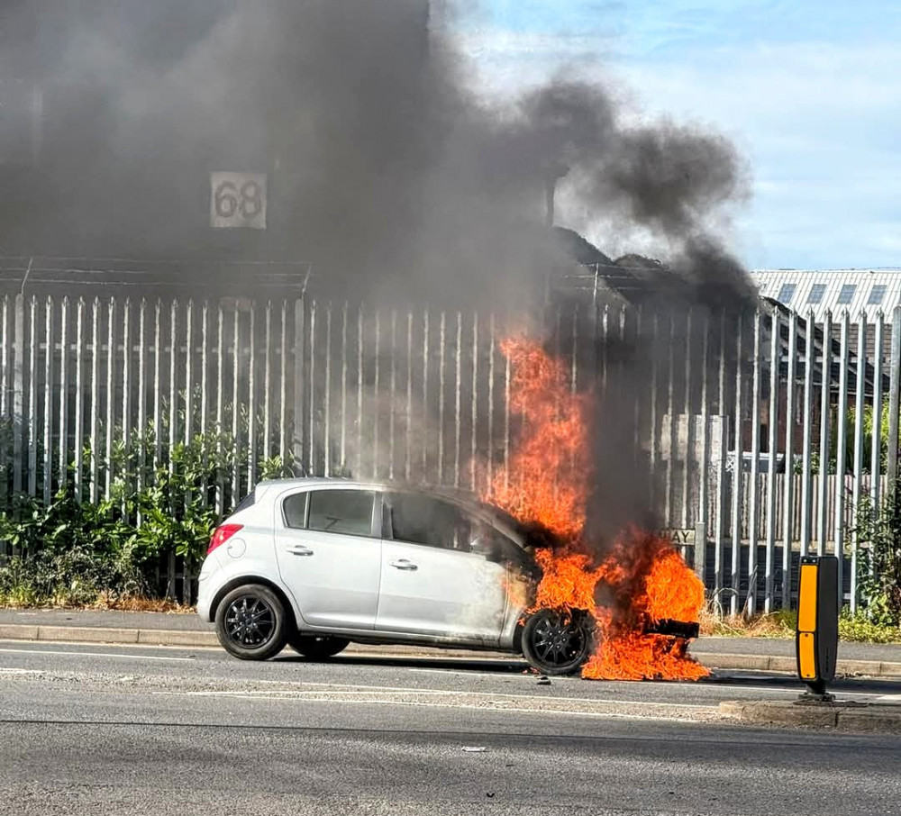 Around 8.40am on Friday 18 July, a silver Vauxhall Corsa burst into flames from the front on Dunwoody Way (Credit: Arman Armani). 