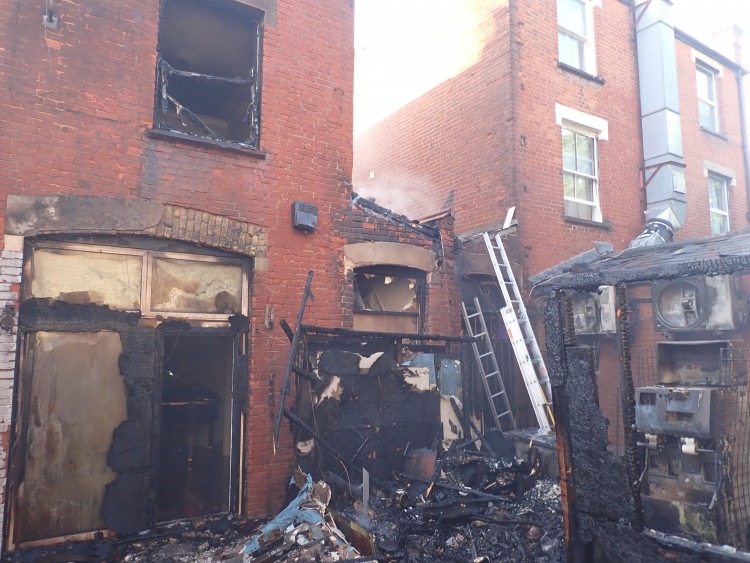 The fire severely damaged the roof and upper floors of the Richmond Road building, with one person taken to hospital (credit: London Fire Brigade).