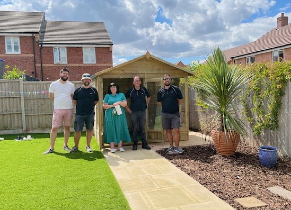 The JLR team handing over the Summerhouse retreat (image via Warwick Rotary Club) The JLR team handing over the Summerhouse retreat (image via Warwick Rotary Club)