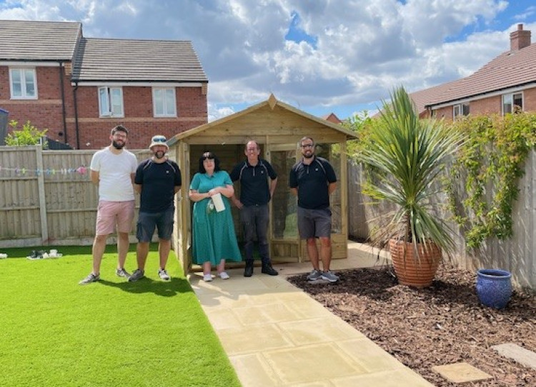 The JLR team handing over the Summerhouse retreat (image via Warwick Rotary Club)