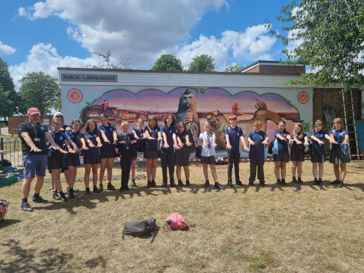 Plume Academy students and teachers got painting to support the local artists with the mural. (Credit: Maldon District Council)