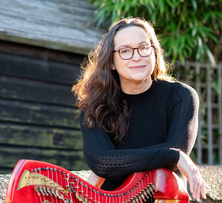 Karen Marshalsay, who is playing on Saturday near Alsager,  with one of her harp collection. (Photo: Rob Adams)