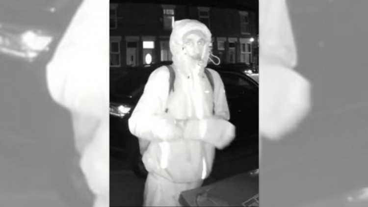 Police are looking to speak to the man in this picture, as they believe he can assist in an investigation into a Ring doorbell theft (Image via GMP)