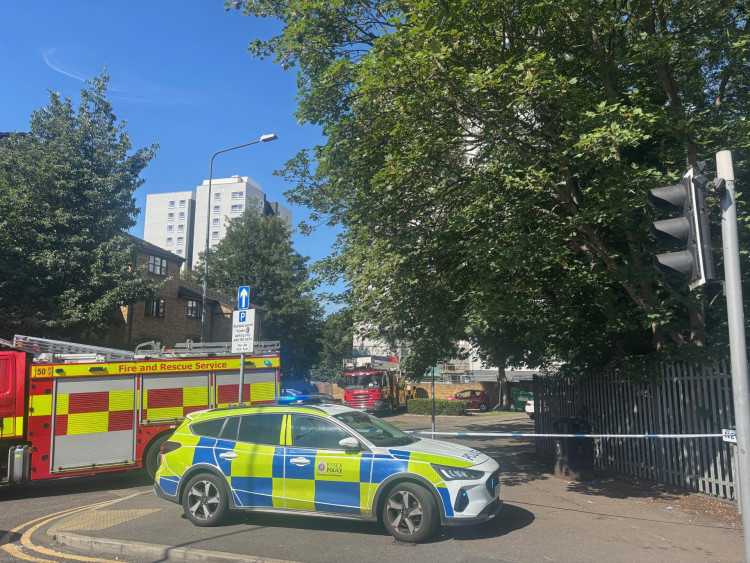 The view of Lionel Oxley House from Bridge Road, with the fire service aerial platform ladder adjacent to the tower block.