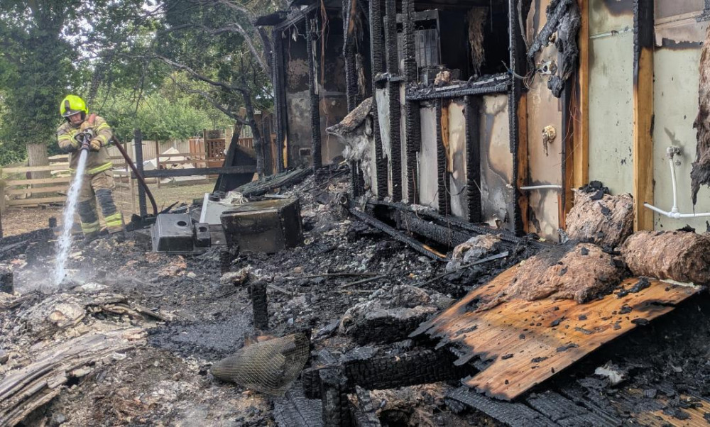 Crews damped down in the evening after battling the blaze. Crews damped down in the evening after battling the blaze.