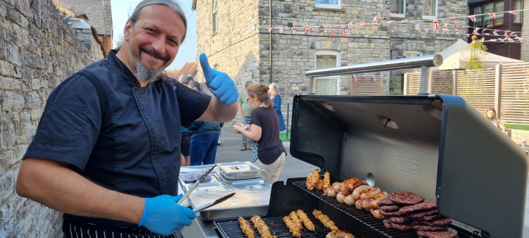 Chef Tudor Bradu cooking at St Benedict's Nursing Home barbecue