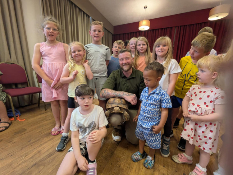 Bernadette the tortoise is a hit with children at the 'Creature Feature' event. (Photo: Nub News)
