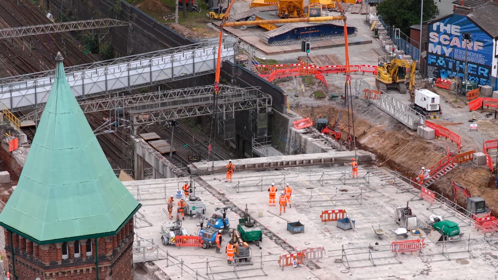 A drone image showing a concrete beam being lifted out of the old Greek Street bridge (Image - Network Rail)