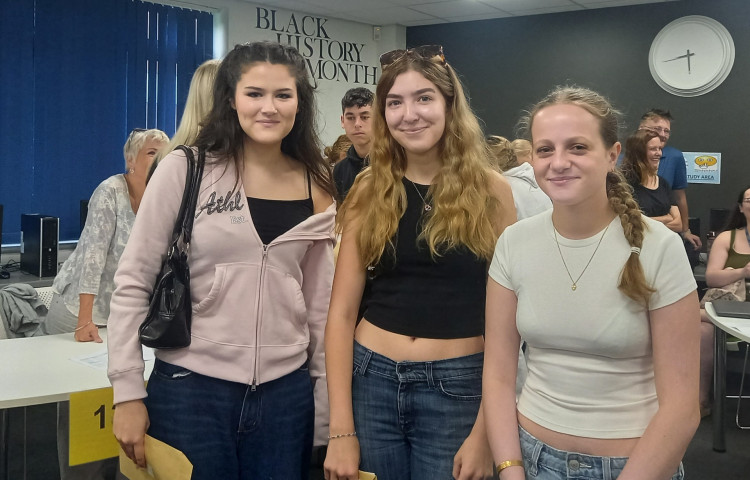 Elise Buckley, Lara Stanwell Hughes and Alice Houchin receiving their results at Sandbach High School and Sixth Form College today (Thursday). (Photo: Caroline Senior) 