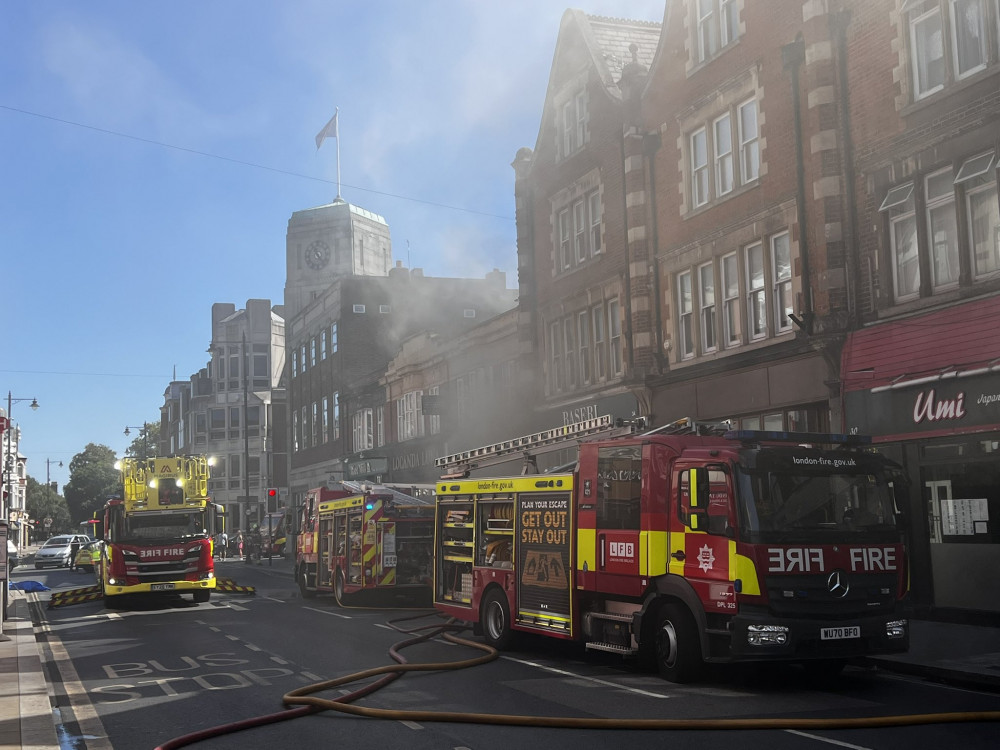 Eight fire engines and two 32-metre ladders were deployed after a fire broke out at Locanda Luna on York Street, Twickenham (credit: @StevoLaughton/X).