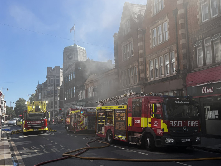 Eight fire engines and two 32-metre ladders were deployed after a fire broke out at Locanda Luna on York Street, Twickenham (credit: @StevoLaughton/X).