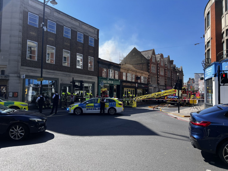 Eight fire engines and two 32-metre ladders were deployed after a fire broke out at Locanda Luna on York Street, Twickenham (credit: @StevoLaughton/X).