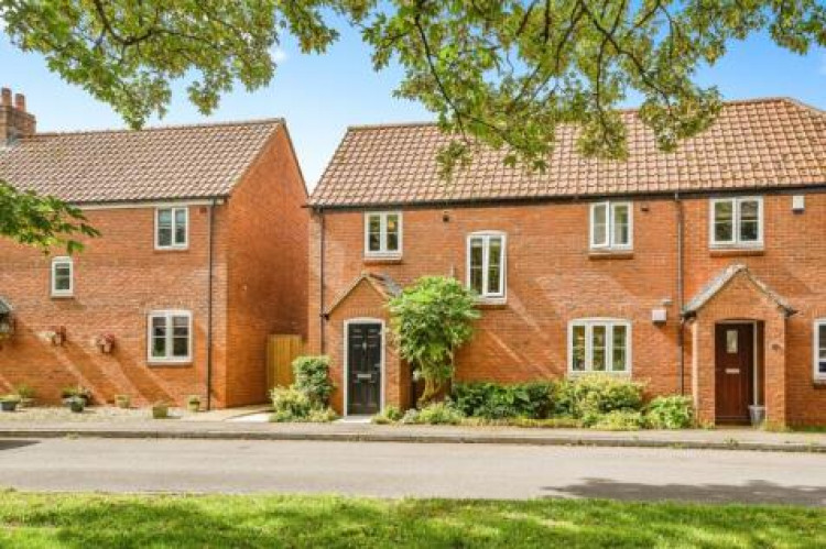 House prices in Shepton Mallet plummet by £30,000 in a year, marking an 8% decline, among Somerset's steepest. 