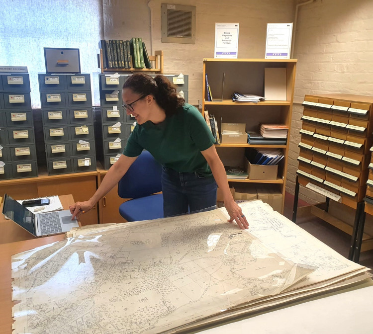 Local studies adviser Katie Owen working with the archive (Credit: CEC)