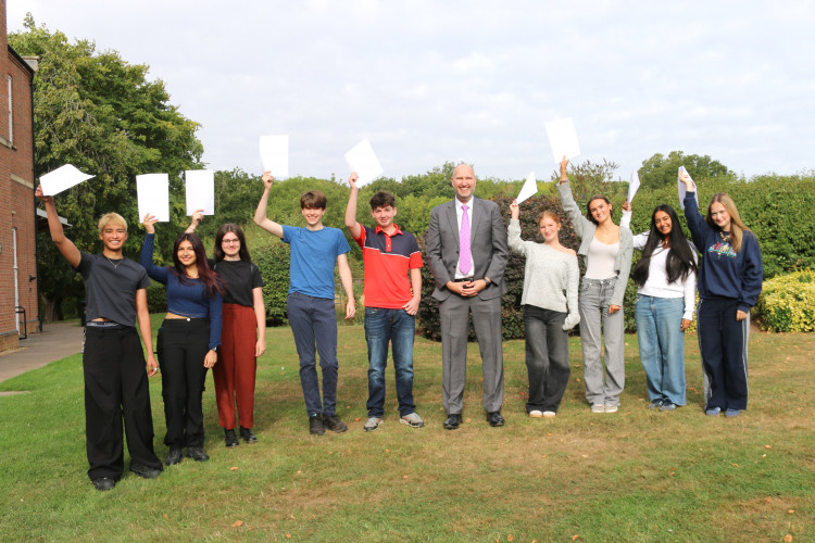 Pupils celebrate their results with College Headmaster, Grove du Toit (image supplied)