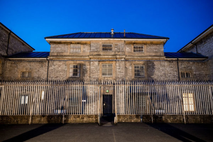 A ghost hunter filmed an "alien-like" figure during a seance at Shepton Mallet Prison.