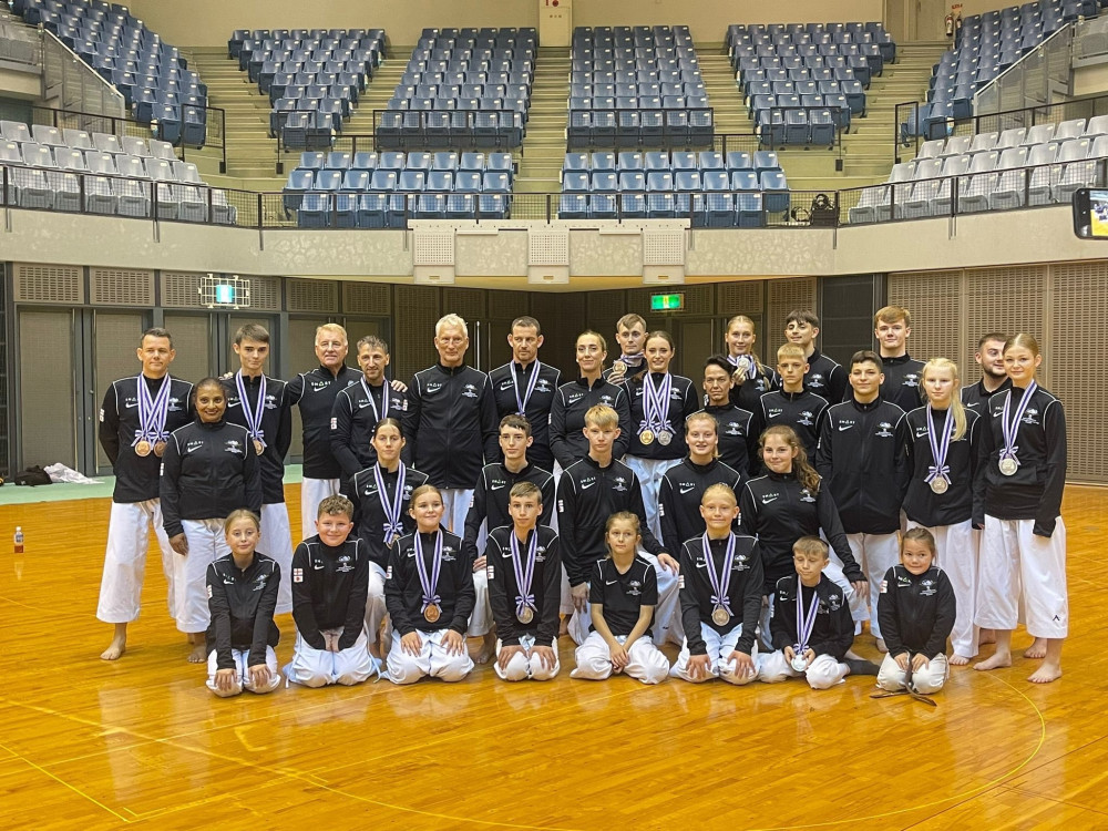 Mark with his team in Japan. Mark with his team in Japan.
