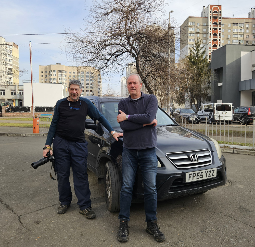 Nich Woolf and co-driver Brian Hepburn in Kiev with a vehicle they brought to donate