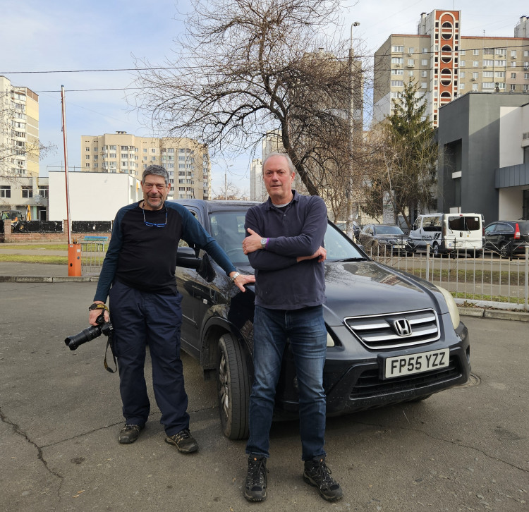 Nich Woolf and co-driver Brian Hepburn in Kiev with a vehicle they brought to donate