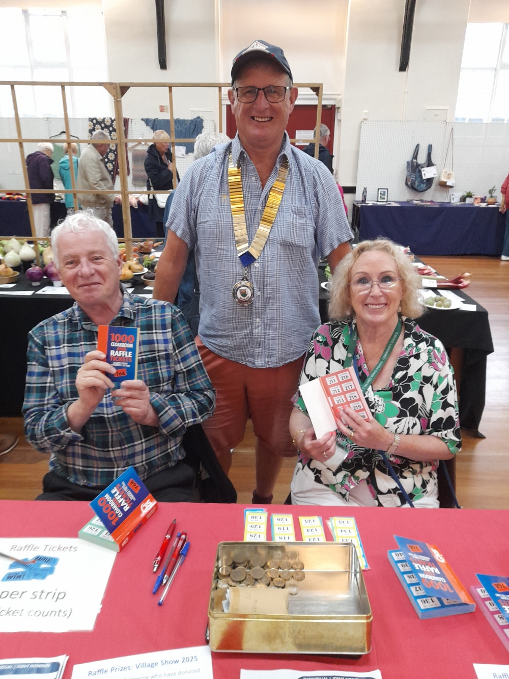 Raffle Table with Chris Franks and Marianne Cowpe with Dinas Powys Community Council Chair Jon Cowpe Raffle Table with Chris Franks and Marianne Cowpe with Dinas Powys Community Council Chair Jon Cowpe