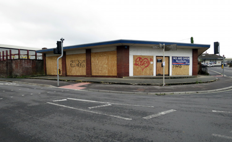 The boarded up site