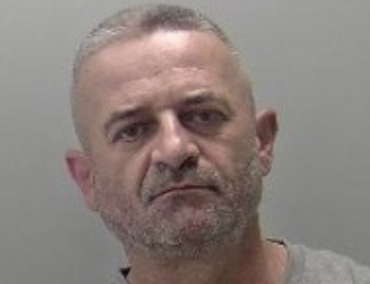 Tomasz Kuzma was charged with arson after a fire at a block of flats in Leamington (image via Warwickshire Police) 