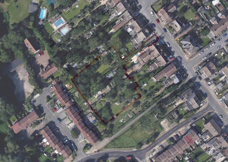 An aerial view of the land where developers want to build 8 homes.