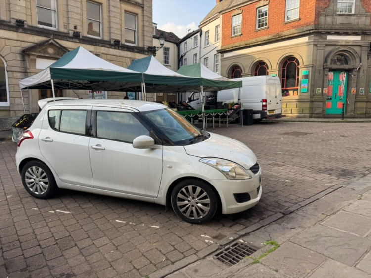 Shepton Mallet Town Council urges drivers to clear High Street by 6 AM every Friday for market day, ensuring safety and space for emergency and waste services. (Photo: Shepton Mallet Friday Market) 