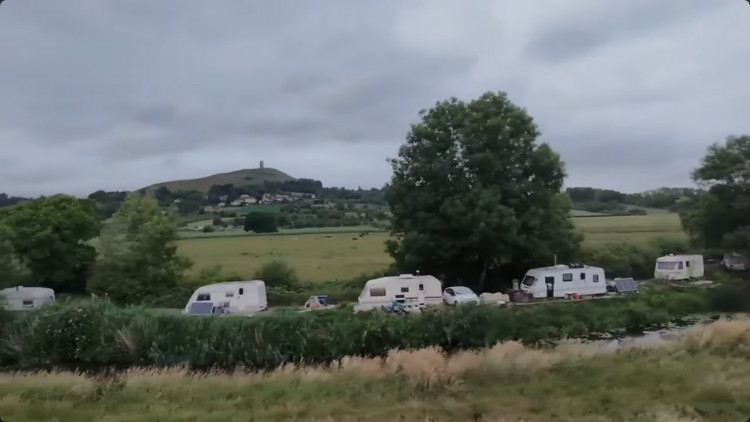 Glastonbury Town Council spent over £17,000 on clearing vans from Common Moor, sparking debate on costs and necessity, urging solutions over costly evictions.