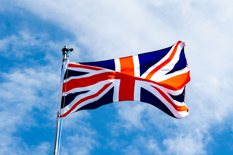 Stockport Council leader Mark Roberts has said that flags can remain so long as they are flown on people's own property, and do not come with slogans or damage (Image - Chris Robert / Unsplash)