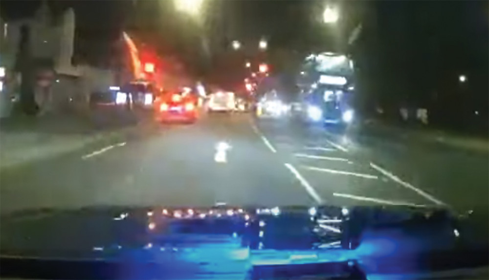 The van driver sped through a red light, narrowly avoiding a collision. The van driver sped through a red light, narrowly avoiding a collision.