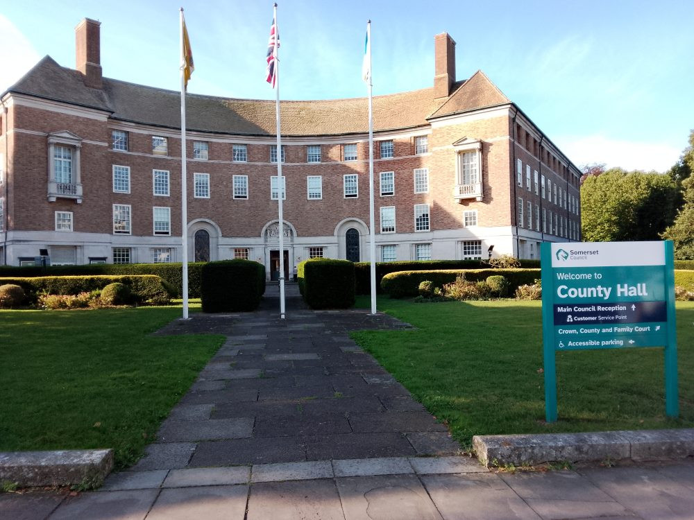 Somerset Council faces a financial crisis, risking service cuts unless more Whitehall funding is secured, due to a projected £5.409 million overspend.
