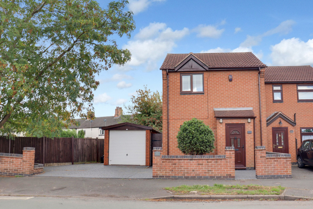 Attractive semi-detached home with driveway and detached garage