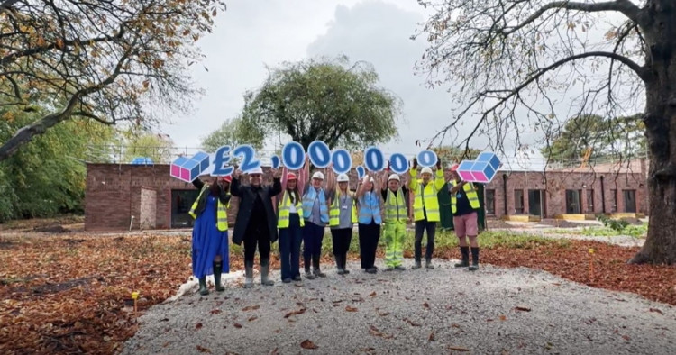 Staff and supporters at St Ann's celebrate reaching the £2m milestone for the 'Build it Together' appeal (Image - St Ann's Hospice)