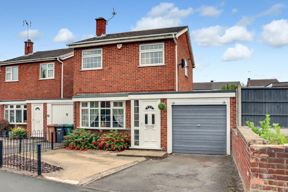 Attractive link-detached property with driveway parking and large garage