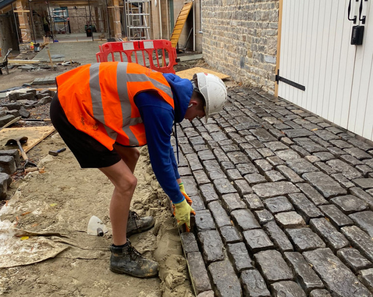 Melhuish & Saunders welcomes two new apprentices, Louis and Ethan, advancing in construction through University Centre Somerset. 