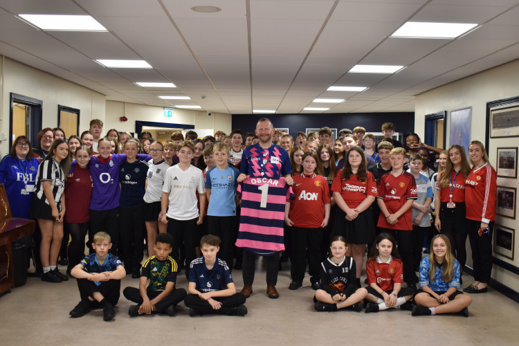 The Macclesfield Academy invited staff and students to wear their favourite sports tops in support of pupil, Oscar Hulley