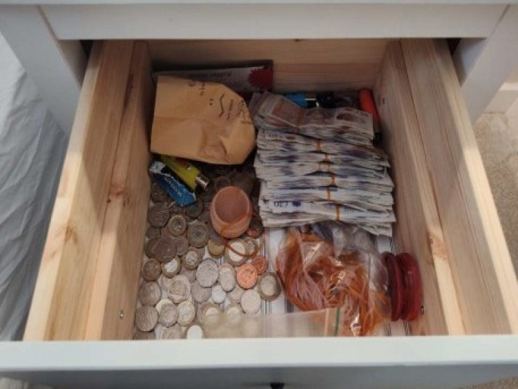 Drugs, cash and watches were seized during police raids in Macclesfield, Wythenshawe and Warrington (Credit: GMP)