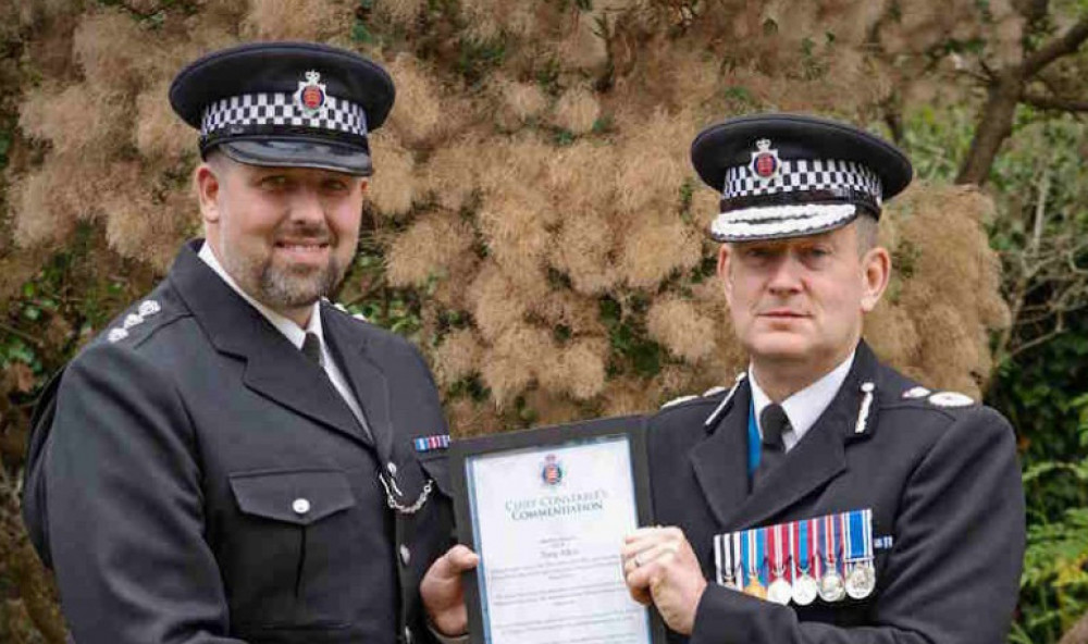Tony Atkin (left) receiving a Chief Constable's commendation during his service in Thurrock.  