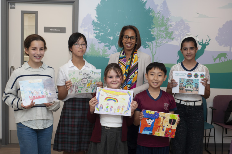 Munira Wilson MP with local school children and their artwork at the opening of Teddington Memorial Hospital's new Pain Clinic (Image supplied)