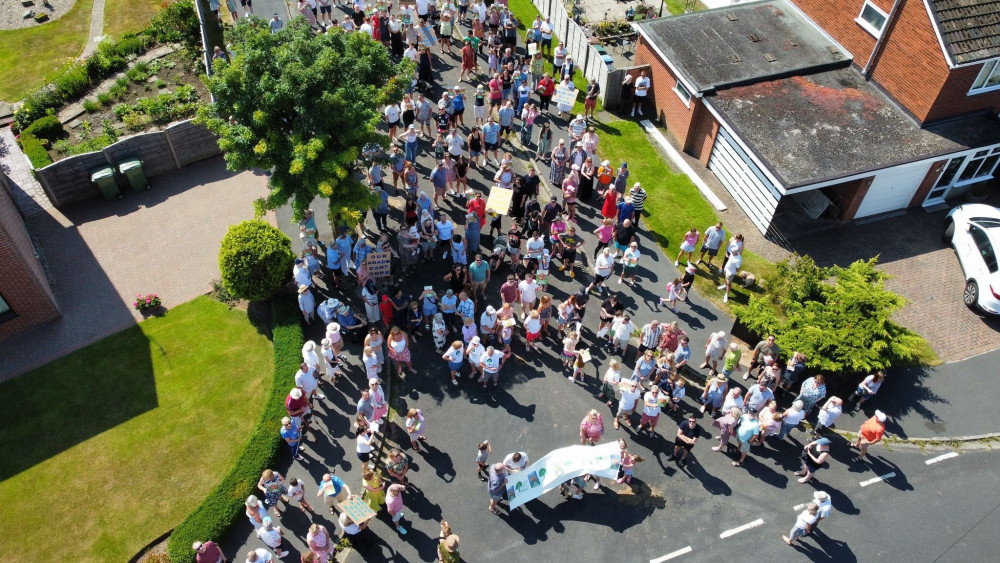 A rally was held in July close to the impacted fields on Sandown Road, which organisers said saw more than 300 residents attend (Image - HCommunications)