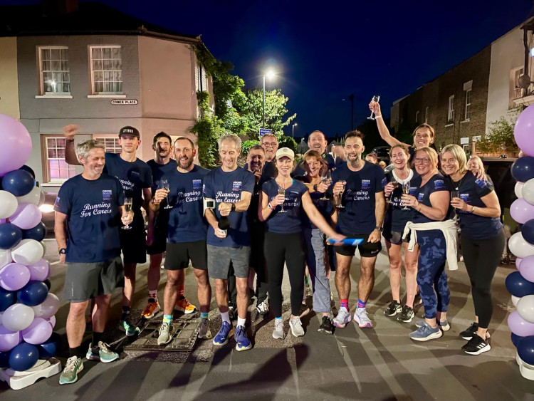 The team were welcomed home with a celebration party at the Builder's Arms pub in Teddington (Credit: Crossroads Care Richmond and Kingston)