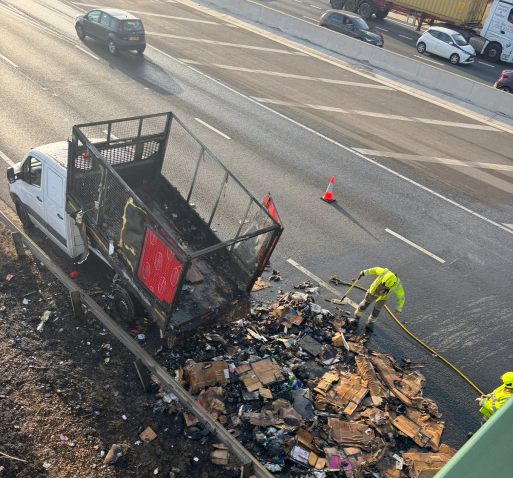 Firefighters clearing up the debris. Firefighters clearing up the debris.