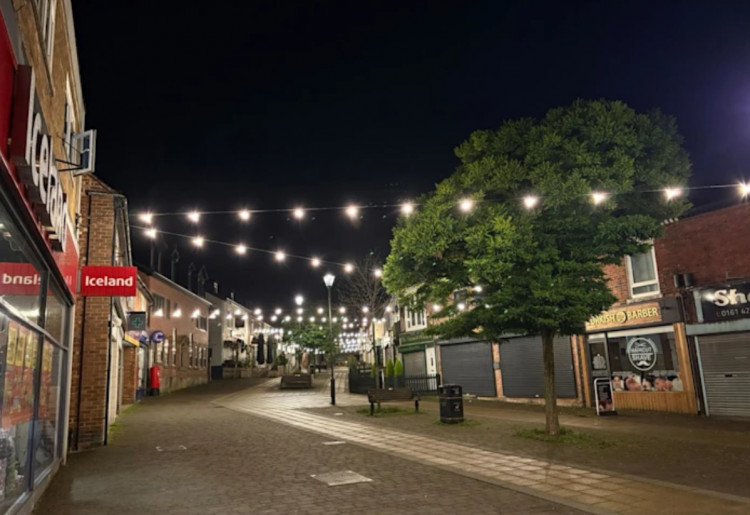 Marple's Market Street now boasts some fancy new festoon lighting to support evening events, night-time shopping, and more (Image - Stockport Council)