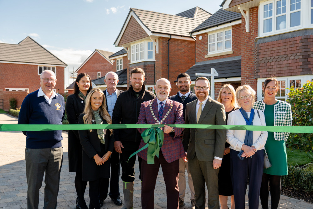 Congleton Town Mayor Robert Brittain cuts the ribbon to open the new show homes at Woodland Manor (Credit: Castle Green Homes) Congleton Town Mayor Robert Brittain cuts the ribbon to open the new show homes at Woodland Manor (Credit: Castle Green Homes)