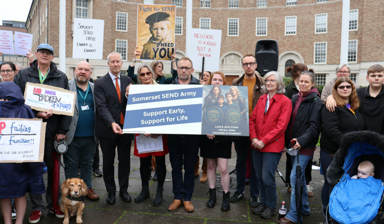 Parents with MPs Gideon Amos and Adam Dance at the Somerset SEND Army protest outside County Hall in Taunton. CREDIT: Ken Bird. 