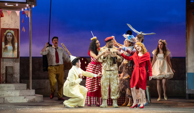 Rosie Lomas (red dress) is looking forward to performing on a stage close to home (Credit: Richard Hubert Smith)