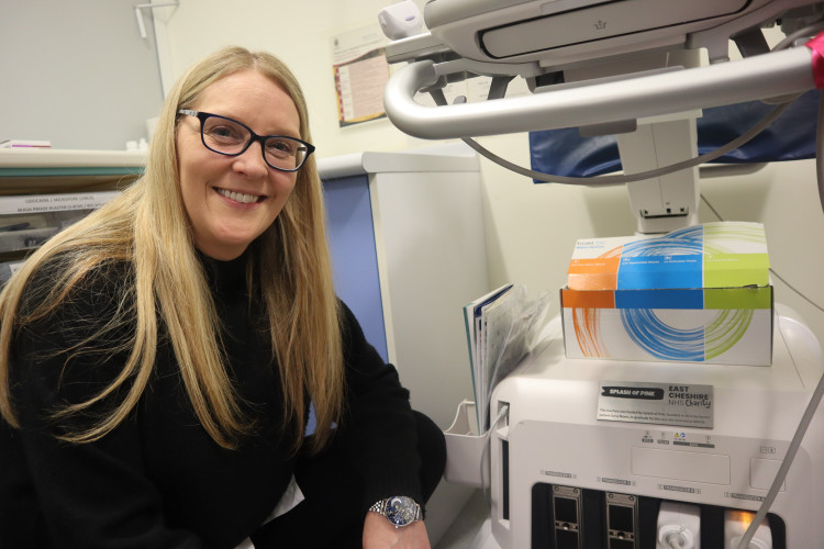 Fundraiser Gena Moors with the ultrasound machine her efforts helped to fund (Credit: ECNHST)