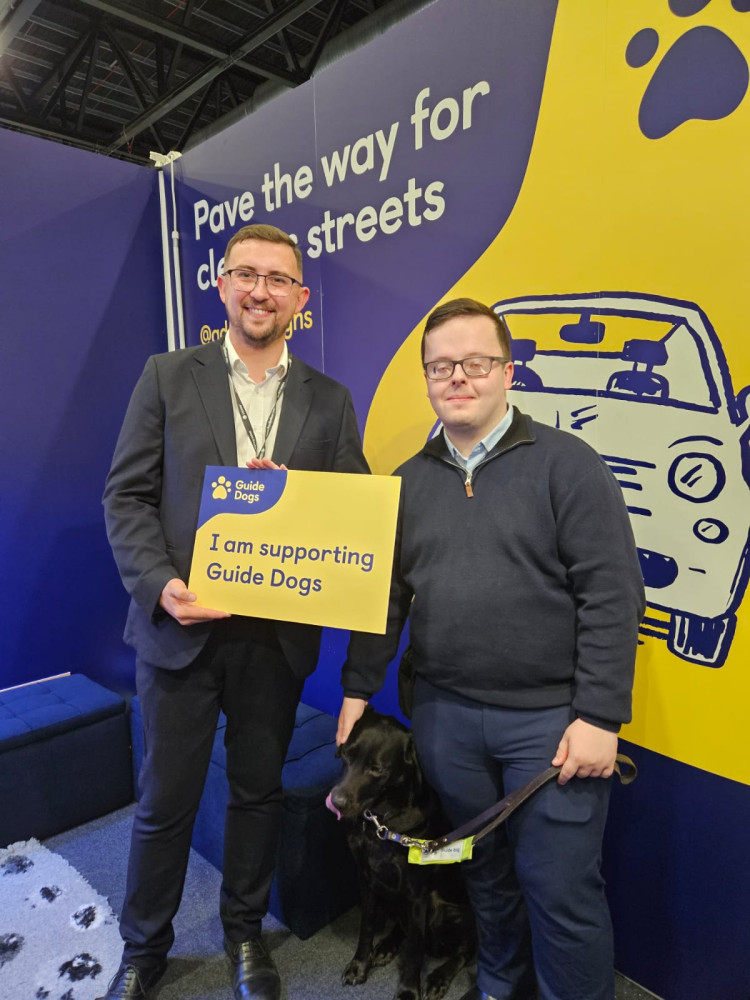 Connor Naismith MP spoke to people with sight loss about the problems caused by pavement parking and inaccessible streets at the Guide Dogs’ exhibition stand this October (Photo: Supplied). Connor Naismith MP spoke to people with sight loss about the problems caused by pavement parking and inaccessible streets at the Guide Dogs’ exhibition stand this October (Photo: Supplied).