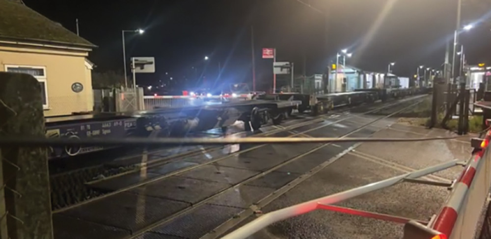 The scene at East Tilbury station. The crossing is closed with empty freight wagons stood while investigations take place. The scene at East Tilbury station. The crossing is closed with empty freight wagons stood while investigations take place.